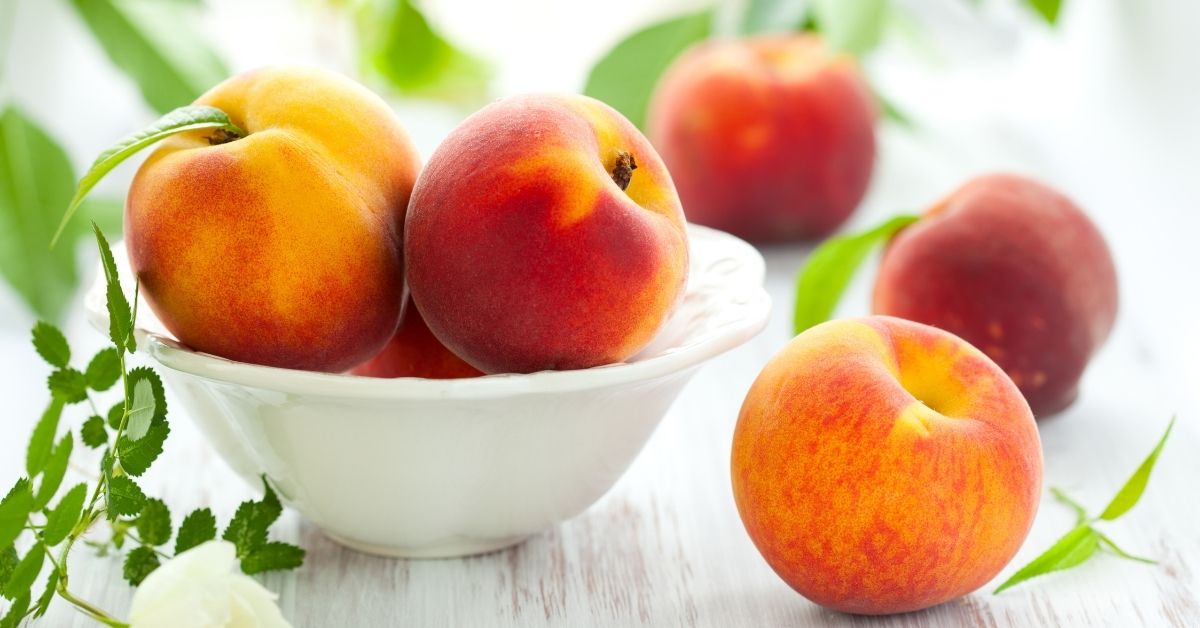 Peaches on a bowl and table