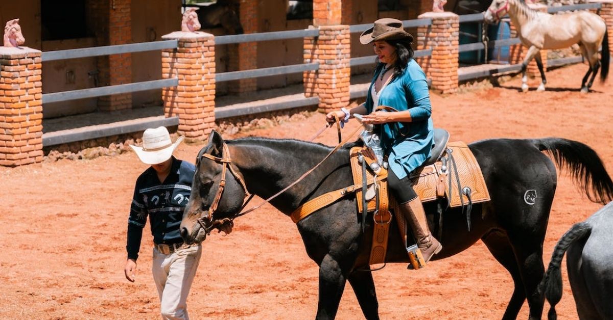 a woman is riding a horse