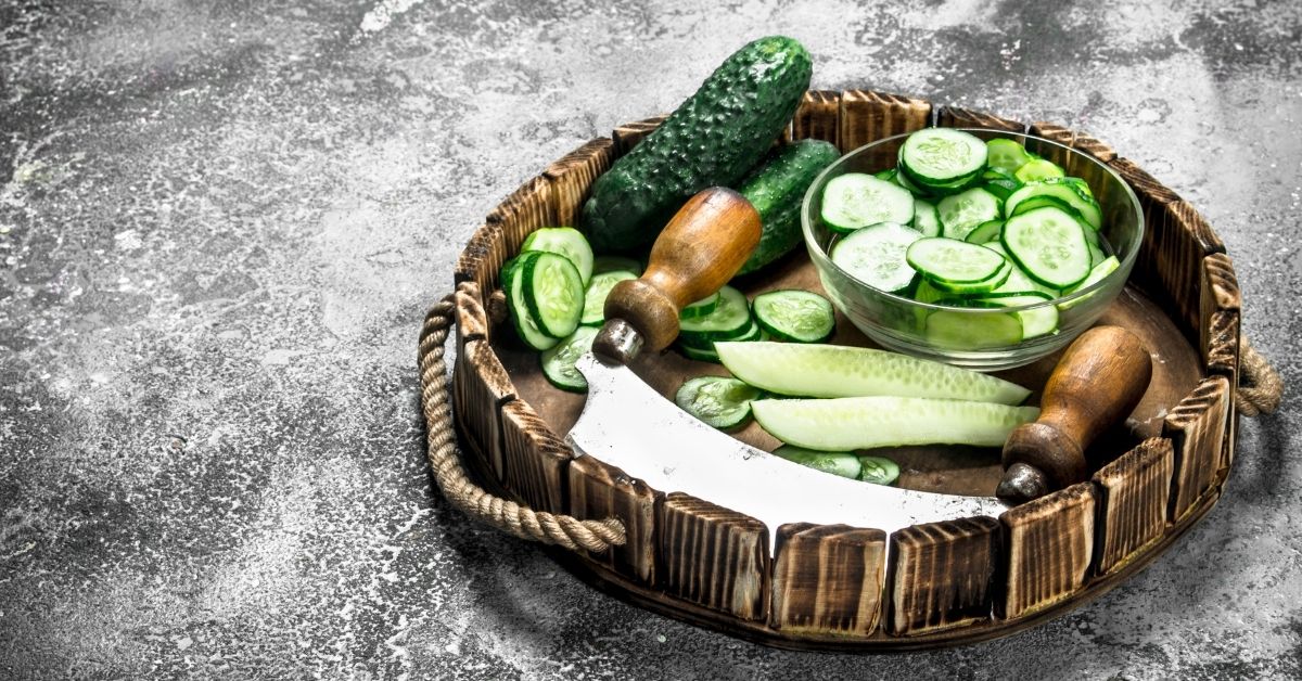 slices of cucumber in a wooden tray