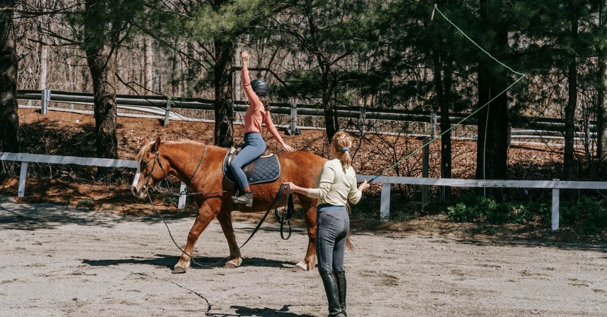 a girl during horseback riding lesson