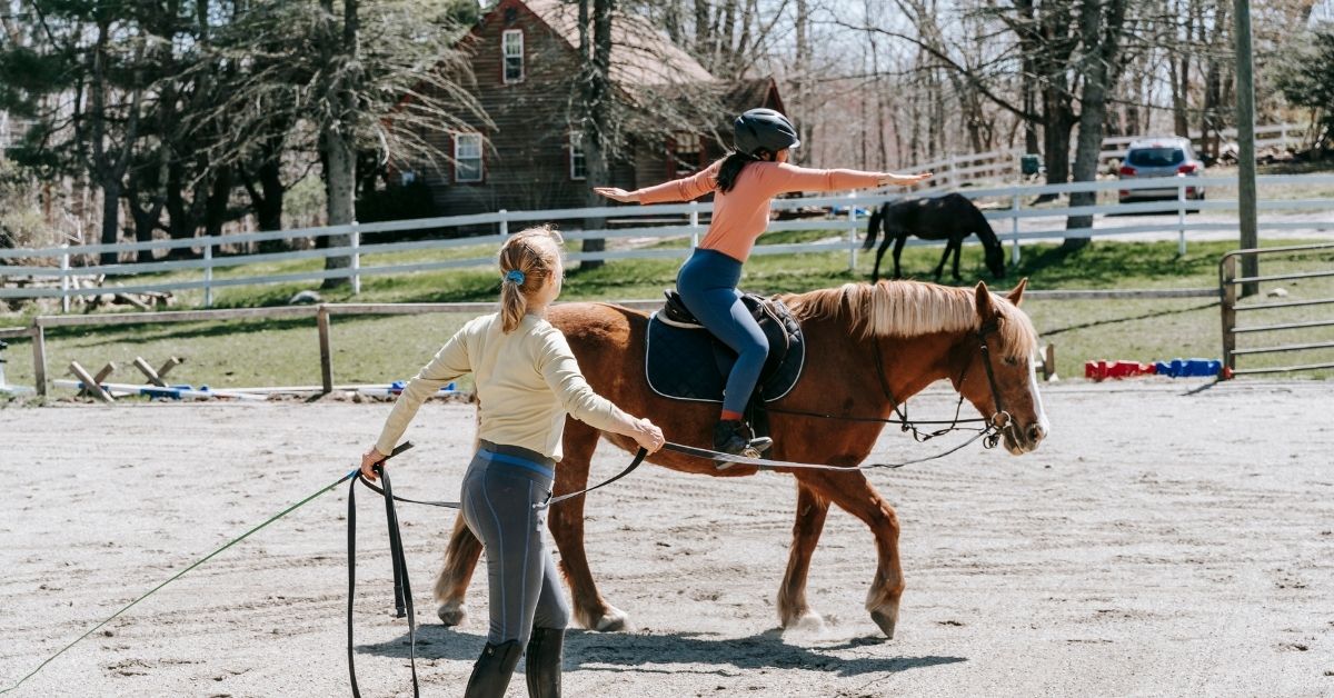 girl at horseback riding lesson