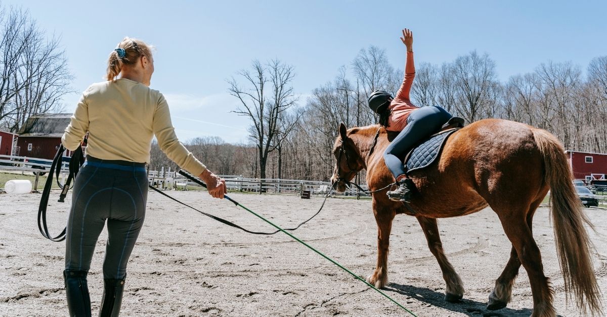 stretching during horseback riding lesson